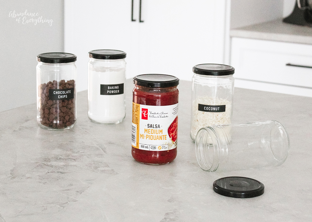 Reuse food items that come in jars to organize your pantry and add labels.